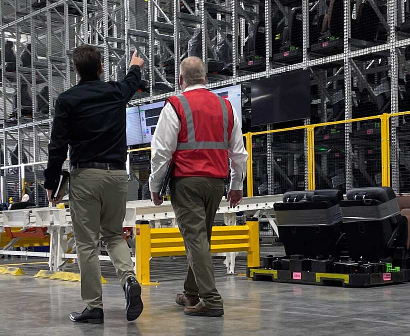 automation consultant walking in facility with customer