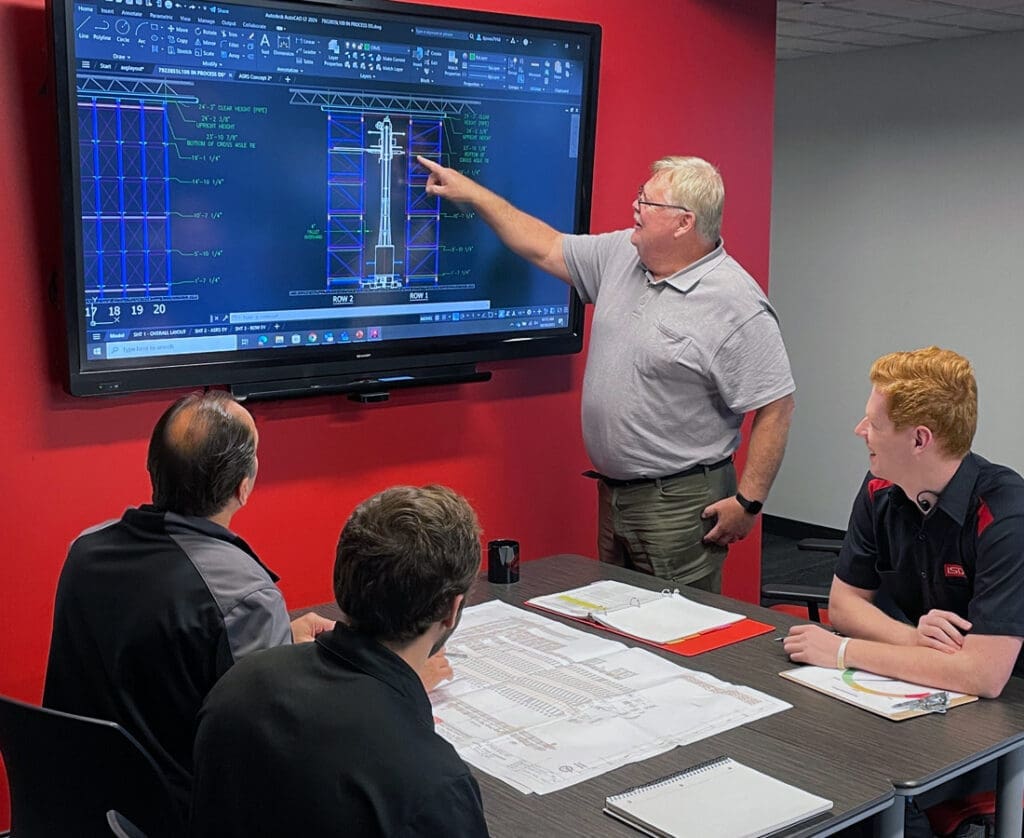 automation consultants designing warehouse system during meeting
