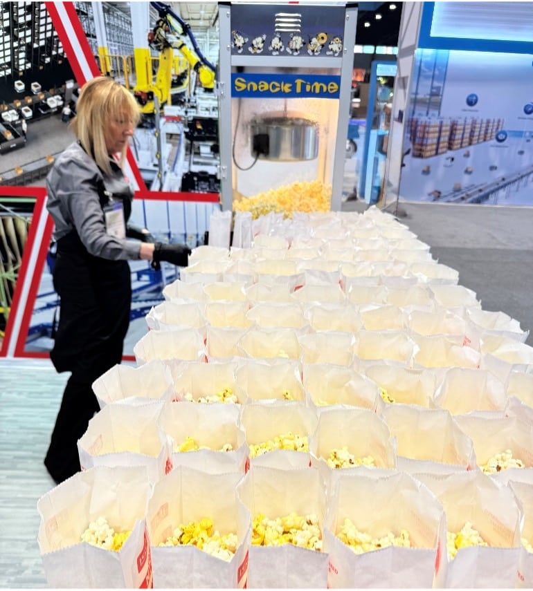 right Staff preparing popcorn for modex trade show snacks