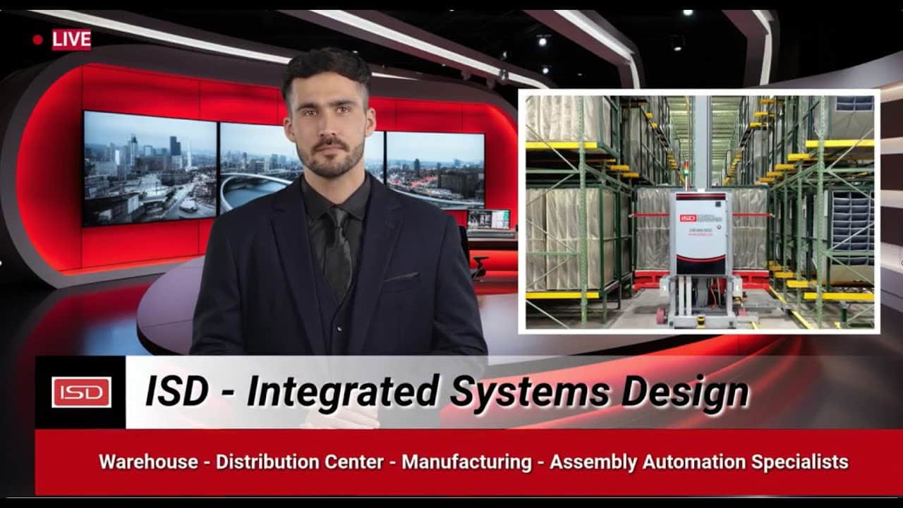 Live news broadcast: a male anchor in a dark suit with an inset image of a warehouse automation setup and an ISD banner reading Integrated Systems Design.